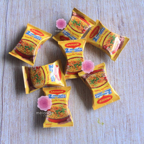 Scattered miniature instant noodle packets